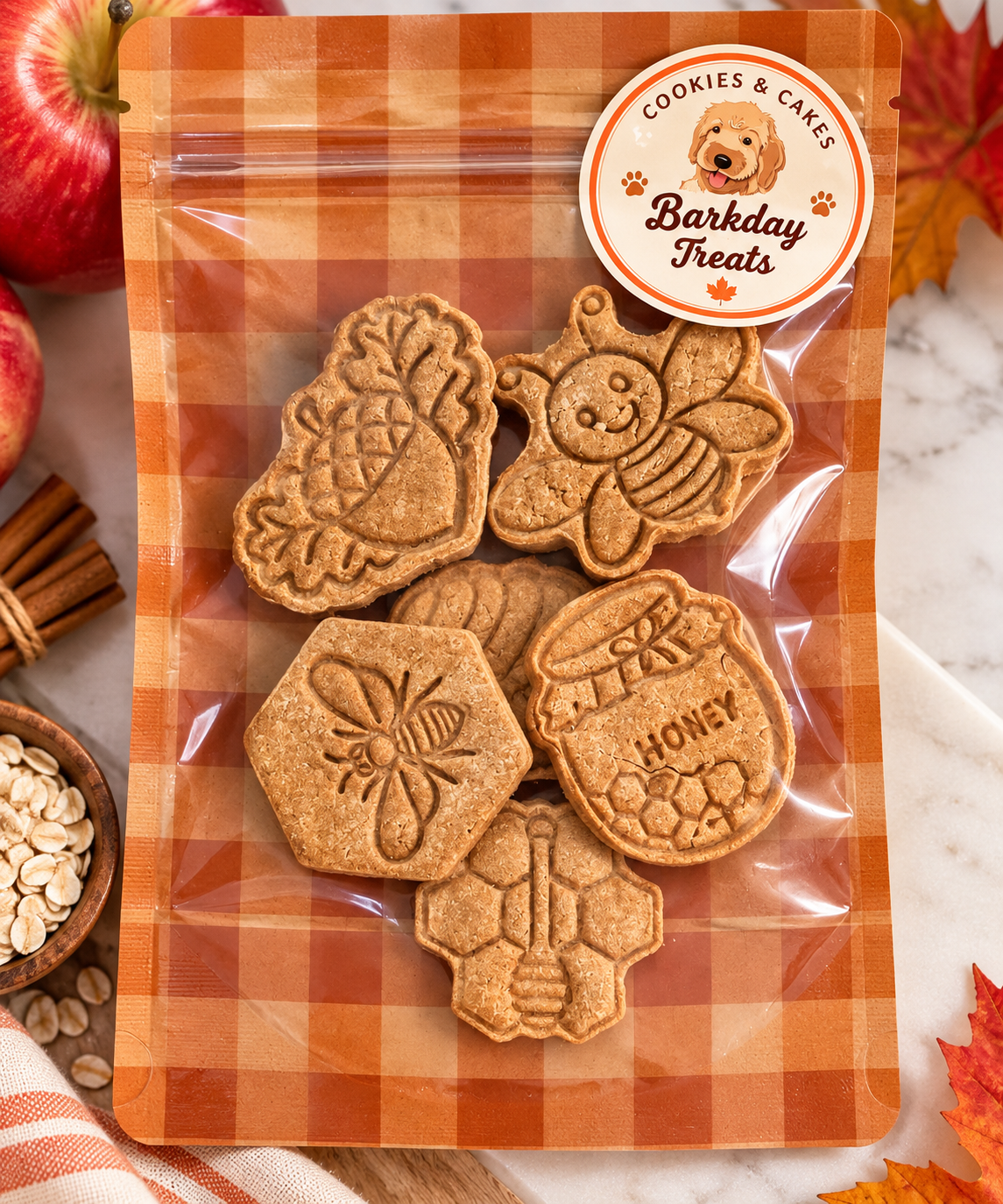 Alt text: Barkday Treats Apple Spice dog cookies, six hand-stamped fall cookies made with Canadian apple purée and organic oat flour.