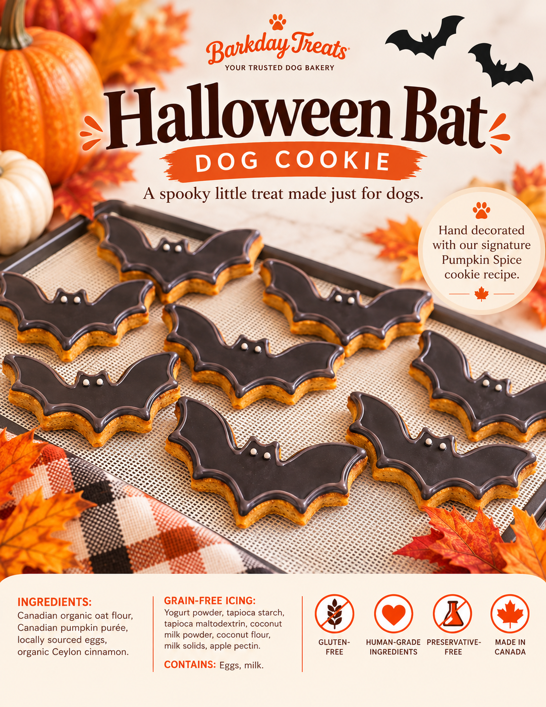 Hand decorated Halloween bat dog cookie from Barkday Treats made with Pumpkin pice cookie and grain-free icing.”